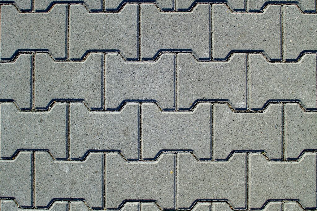 Texture of concrete pavement or sidewalk with paving slabs